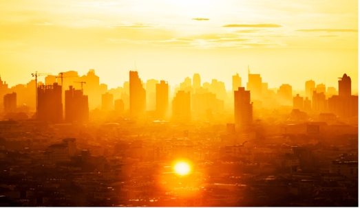 city skyline in hot, yellow sunlight
