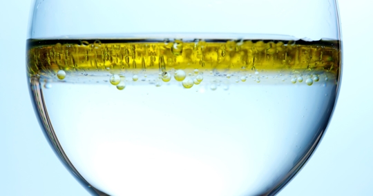 Picture of Oil Floating In A Glass of Water
