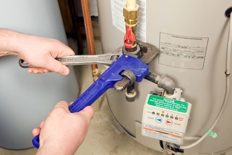 plumber repairing water heater