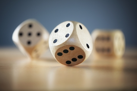 rolling dice signifying odds