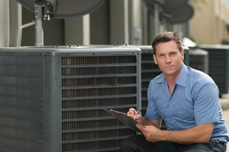 handsome man in front of air conditioner