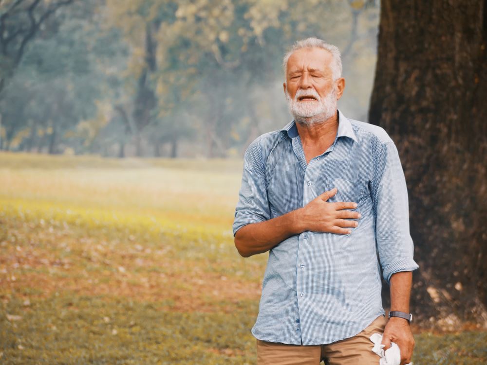 elderly man sweating outside