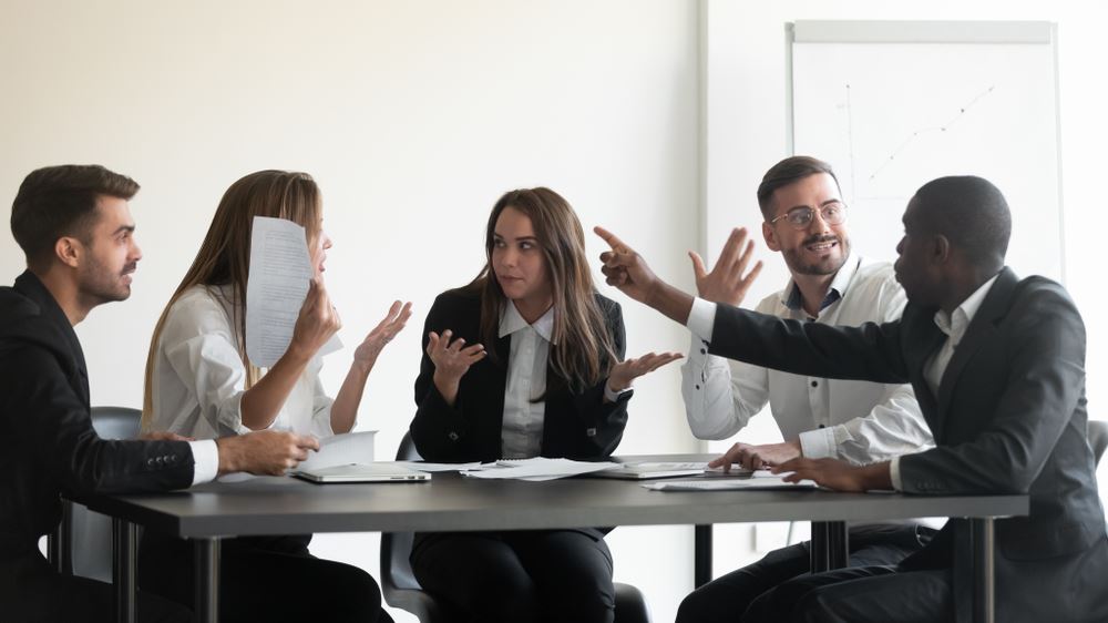 people around a table debating