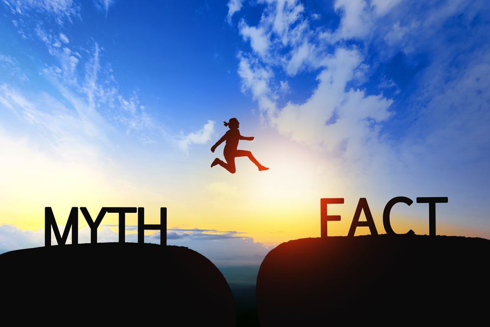 woman jumping over myth into fact