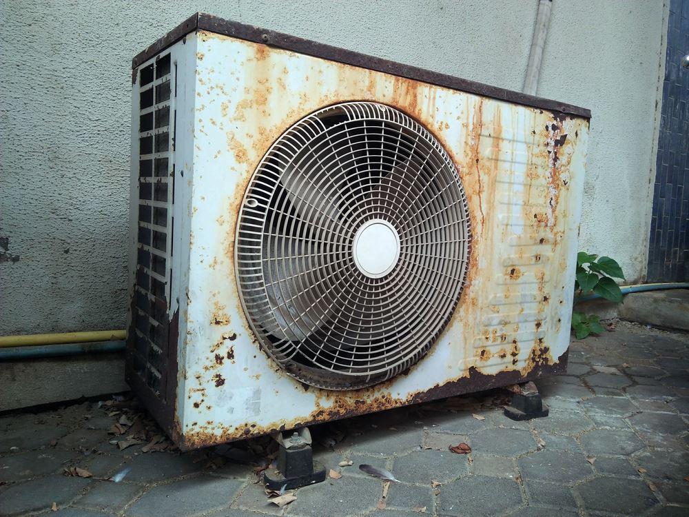 old, rusty air conditioning unit outside