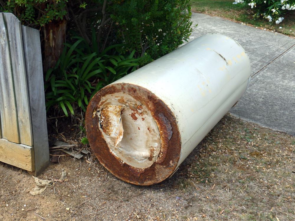 old water heater on its side