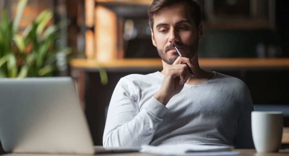 man thinking about whether to repair or replace