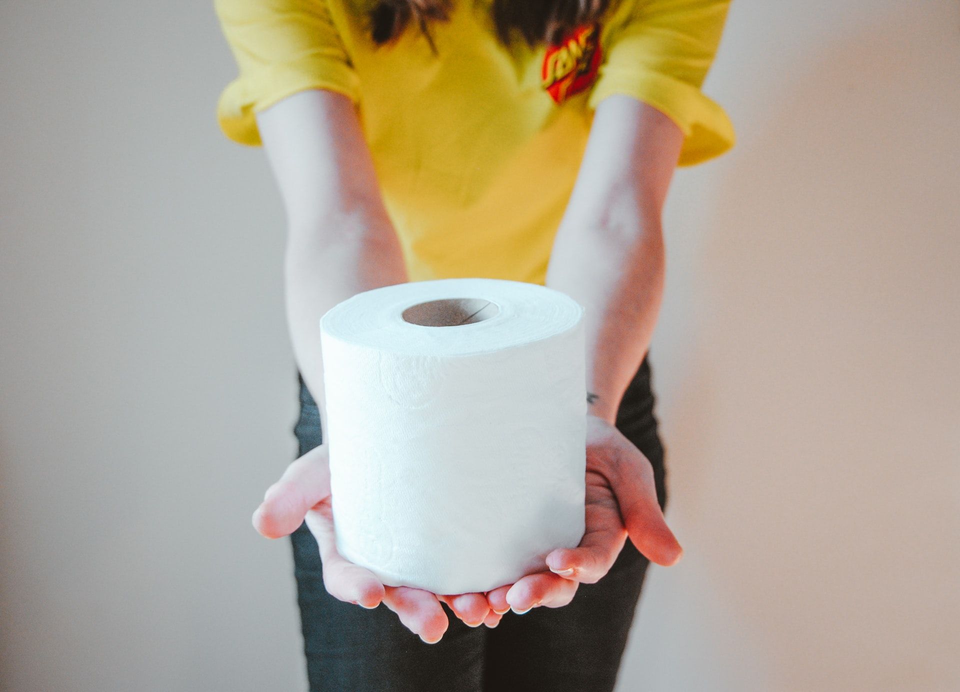 woman holding toilet paper